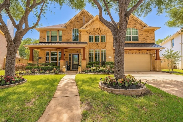 5515 E Terrace Gable Cir, Katy, TX 77494 - traditional-style home with driveway, a garage, a standing seam roof, a porch, and stone siding