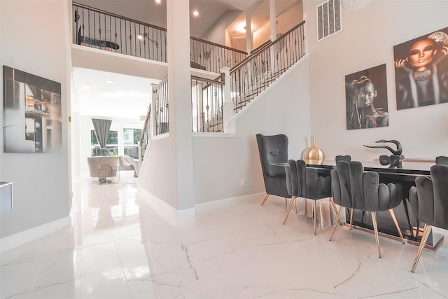 5515 E Terrace Gable Cir, Katy, TX 77494 - dining room with marble tiled floors, stairway, a towering ceiling, and recessed lighting
