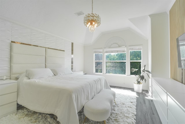 5515 E Terrace Gable Cir, Katy, TX 77494 - bedroom with a chandelier, wood finished floors, and vaulted ceiling