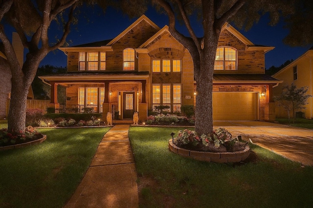 5515 E Terrace Gable Cir, Katy, TX 77494 - view of front of house with a garage, driveway, covered porch, and stone siding