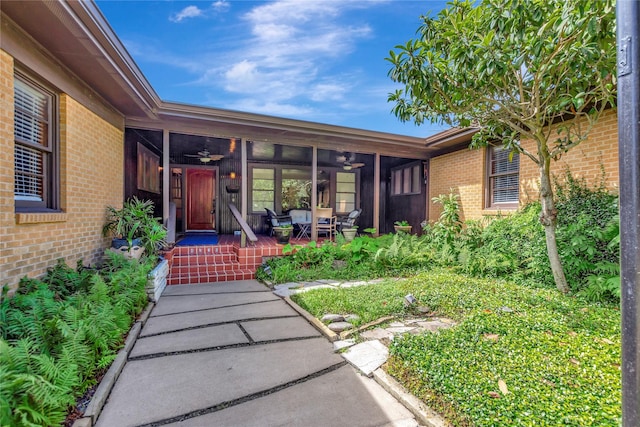 4316 Caduceus Pl, Galveston, TX 77550 - doorway to property with a ceiling fan and brick siding
