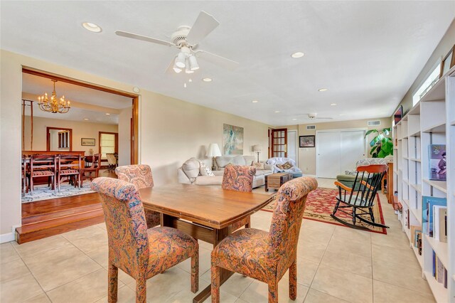 4316 Caduceus Pl, Galveston, TX 77550 - dining space with a ceiling fan, light tile patterned floors, a chandelier, and recessed lighting