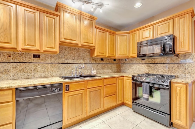 4316 Caduceus Pl, Galveston, TX 77550 - kitchen with black appliances, light tile patterned floors, backsplash, and light brown cabinets