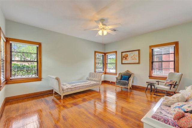 4316 Caduceus Pl, Galveston, TX 77550 - bedroom with multiple windows, wood finished floors, and ceiling fan