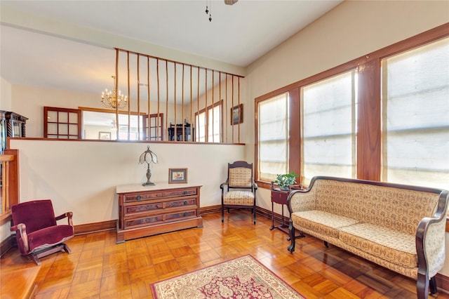 4316 Caduceus Pl, Galveston, TX 77550 - living area with a chandelier and baseboards