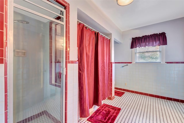 4316 Caduceus Pl, Galveston, TX 77550 - full bath featuring tile walls, a stall shower, and a wainscoted wall