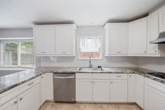 11607 Knobcrest Dr, Houston, TX 77070 - kitchen with appliances with stainless steel finishes, white cabinetry, backsplash, and light stone counters