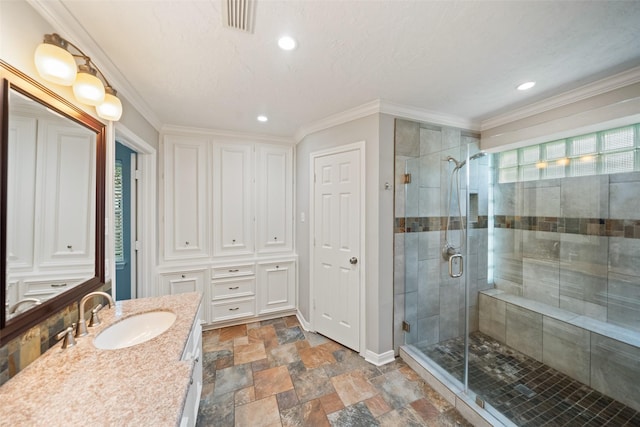 11607 Knobcrest Dr, Houston, TX 77070 - full bathroom featuring vanity, a shower stall, stone finish flooring, recessed lighting, and ornamental molding