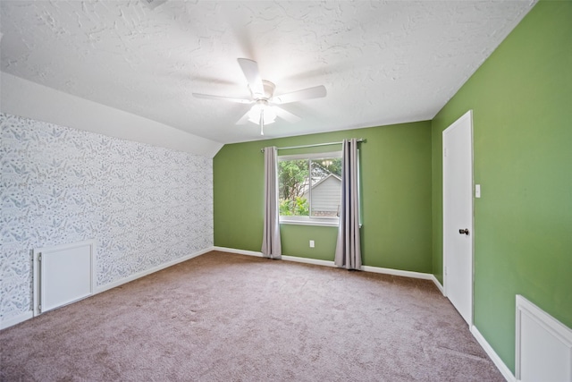 11607 Knobcrest Dr, Houston, TX 77070 - carpeted empty room with a textured ceiling, ceiling fan, and vaulted ceiling