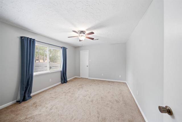 11607 Knobcrest Dr, Houston, TX 77070 - unfurnished room with light carpet, a textured ceiling, and a ceiling fan