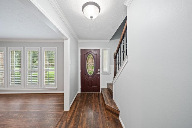 11607 Knobcrest Dr, Houston, TX 77070 - foyer with wood-type flooring, a textured ceiling, stairway, and ornamental molding