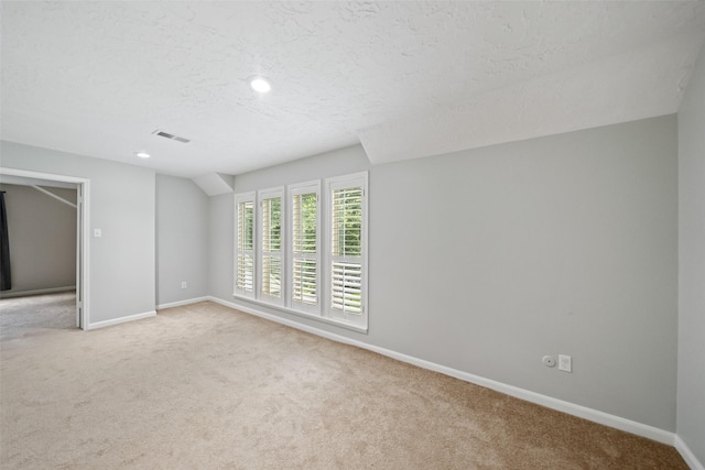 11607 Knobcrest Dr, Houston, TX 77070 - spare room with light colored carpet, a textured ceiling, and recessed lighting