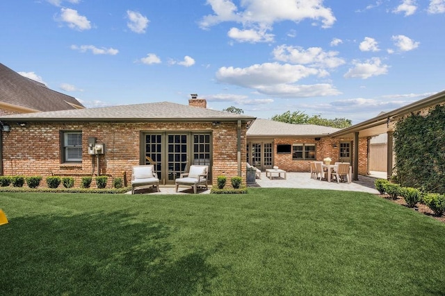 1213 Briarmead Dr, Houston, TX 77057 - rear view of property with brick siding, a chimney, a yard, a patio area, and french doors