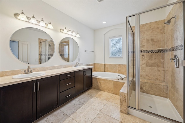 1124 W 24th St Unit B, Houston, TX 77008 - full bath featuring a stall shower, a garden tub, double vanity, and tile patterned floors