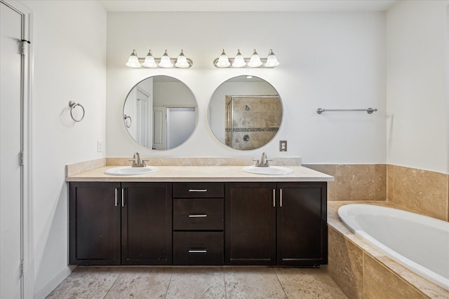 1124 W 24th St Unit B, Houston, TX 77008 - full bathroom featuring double vanity, a bath, and a tile shower
