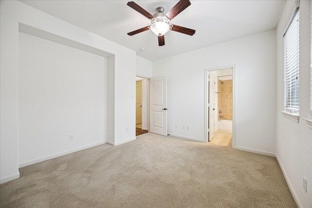 1124 W 24th St Unit B, Houston, TX 77008 - unfurnished bedroom with carpet, multiple windows, and ensuite bathroom