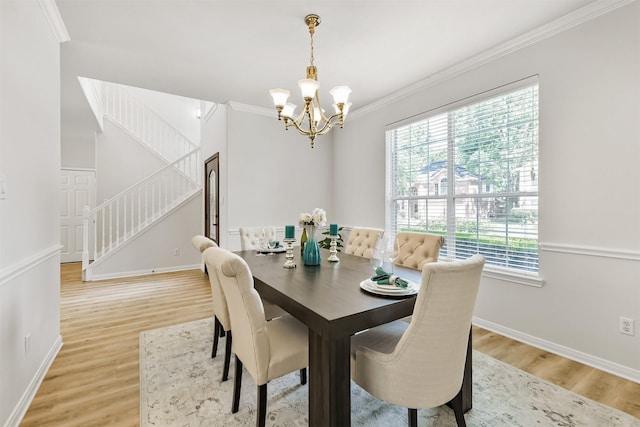 8006 Sports Haven Dr, Humble, TX 77346 - dining room with a chandelier, stairs, light wood-type flooring, healthy amount of natural light, and crown molding