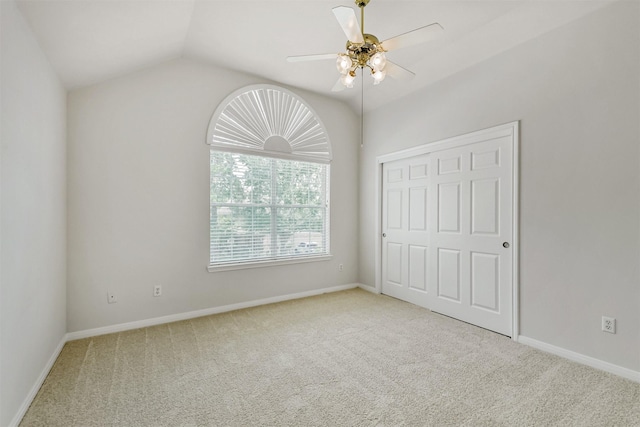 8006 Sports Haven Dr, Humble, TX 77346 - unfurnished bedroom featuring carpet floors, a closet, lofted ceiling, and ceiling fan