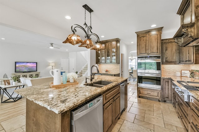 8006 Sports Haven Dr, Humble, TX 77346 - kitchen featuring stainless steel appliances, recessed lighting, decorative backsplash, an island with sink, and a ceiling fan