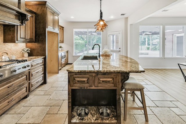8006 Sports Haven Dr, Humble, TX 77346 - kitchen with ventilation hood, stone tile flooring, stainless steel appliances, a kitchen island with sink, and recessed lighting