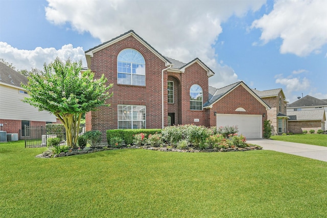 8006 Sports Haven Dr, Humble, TX 77346 - traditional-style home with concrete driveway, brick siding, and a garage