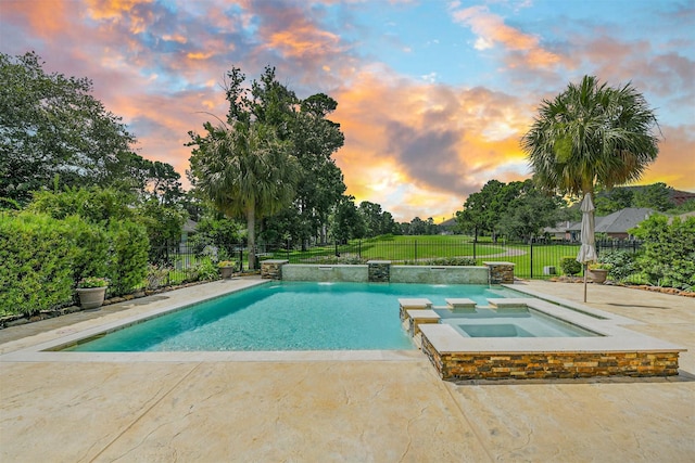 8006 Sports Haven Dr, Humble, TX 77346 - pool at dusk featuring a fenced backyard, a patio, and a pool with connected hot tub
