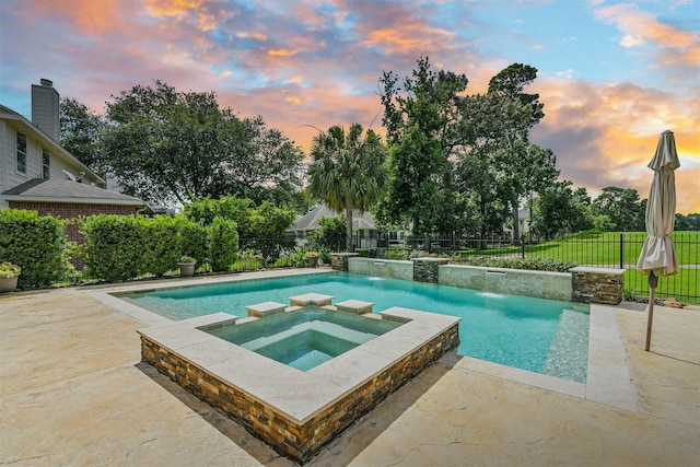 8006 Sports Haven Dr, Humble, TX 77346 - pool at dusk with a pool with connected hot tub, a fenced backyard, and a patio