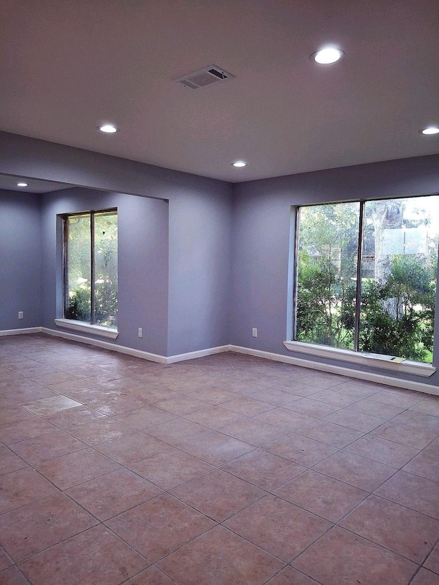 7807 Bellerive Dr, Houston, TX 77036 - tiled empty room featuring recessed lighting