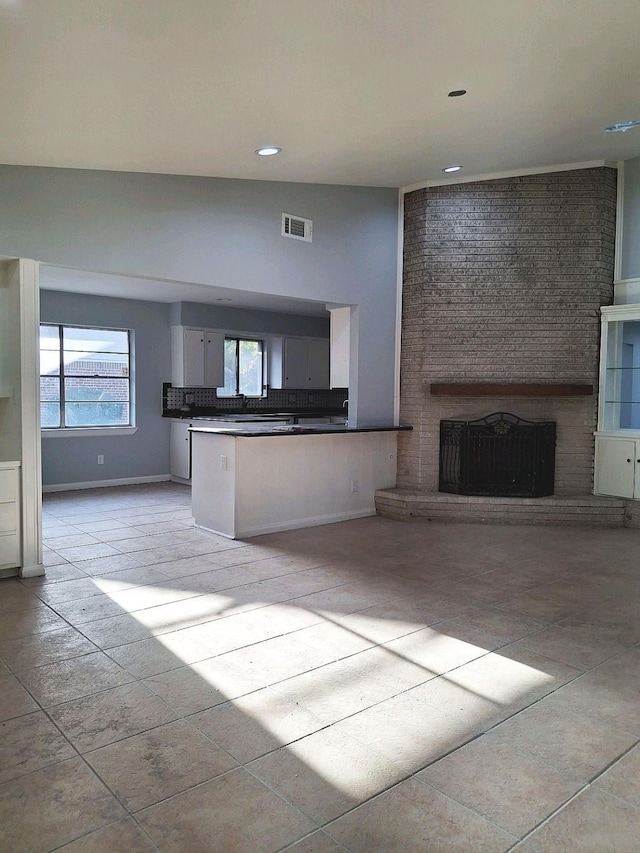 7807 Bellerive Dr, Houston, TX 77036 - unfurnished living room featuring a fireplace and recessed lighting