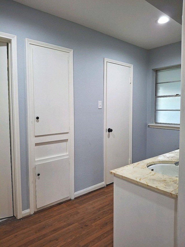 7807 Bellerive Dr, Houston, TX 77036 - hallway featuring dark wood-type flooring and recessed lighting