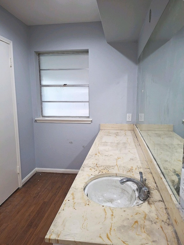 7807 Bellerive Dr, Houston, TX 77036 - bathroom featuring wood finished floors and double vanity