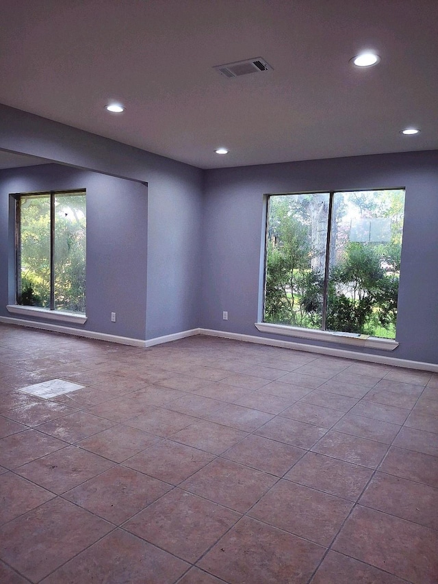7807 Bellerive Dr, Houston, TX 77036 - tiled empty room with recessed lighting and plenty of natural light