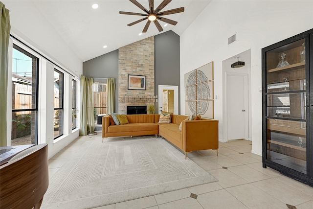 8727 Vinkins Rd, Houston, TX 77071 - living room with high vaulted ceiling, ceiling fan, plenty of natural light, a fireplace, and light tile patterned floors