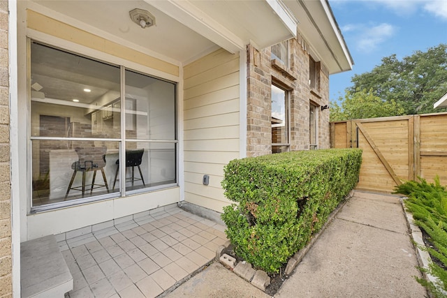 8727 Vinkins Rd, Houston, TX 77071 - doorway to property with stone siding and a gate
