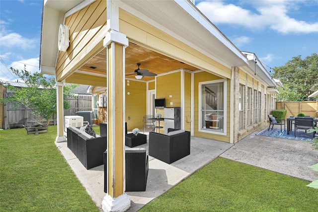 8727 Vinkins Rd, Houston, TX 77071 - fenced backyard with an outdoor hangout area, a patio, a ceiling fan, and outdoor dining area