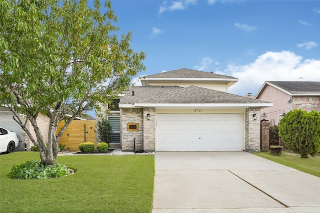 8727 Vinkins Rd, Houston, TX 77071 - view of front facade featuring roof with shingles, concrete driveway, and a garage