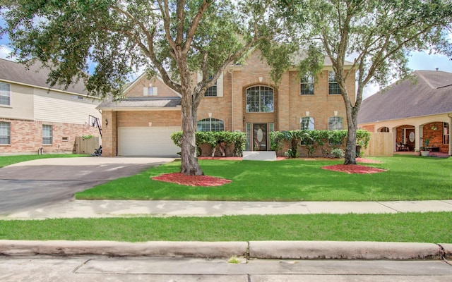 11704 Shoal Lndg, Pearland, TX 77584 - view of front facade with driveway, a front lawn, and brick siding