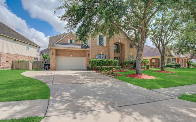 11704 Shoal Lndg, Pearland, TX 77584 - traditional-style house featuring driveway, brick siding, a garage, and roof with shingles