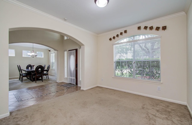11704 Shoal Lndg, Pearland, TX 77584 - unfurnished room featuring a chandelier, ornamental molding, carpet floors, and arched walkways