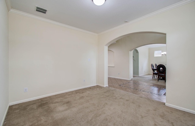 11704 Shoal Lndg, Pearland, TX 77584 - carpeted spare room featuring ornamental molding, tile patterned flooring, and arched walkways