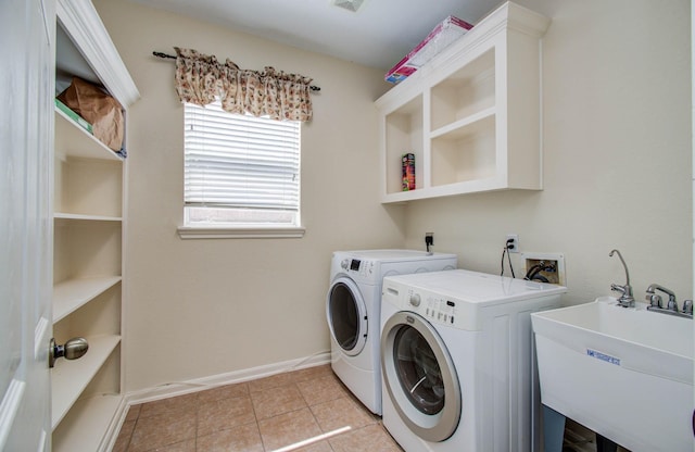 11704 Shoal Lndg, Pearland, TX 77584 - laundry area with independent washer and dryer and light tile patterned floors