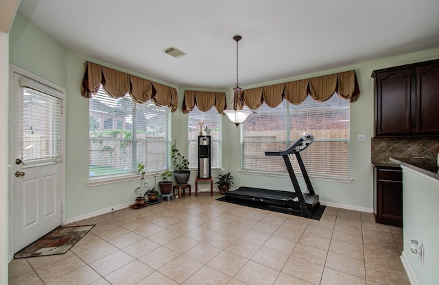 11704 Shoal Lndg, Pearland, TX 77584 - workout area featuring baseboards and light tile patterned floors