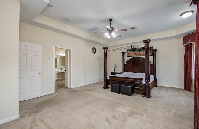 11704 Shoal Lndg, Pearland, TX 77584 - carpeted bedroom featuring ensuite bath, ceiling fan, and a tray ceiling