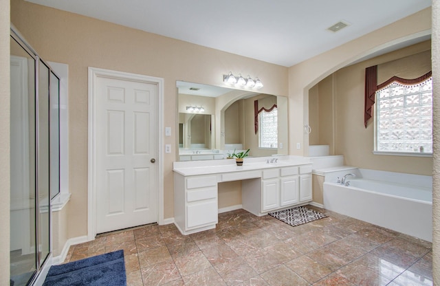11704 Shoal Lndg, Pearland, TX 77584 - full bathroom featuring plenty of natural light, vanity, a garden tub, and a stall shower