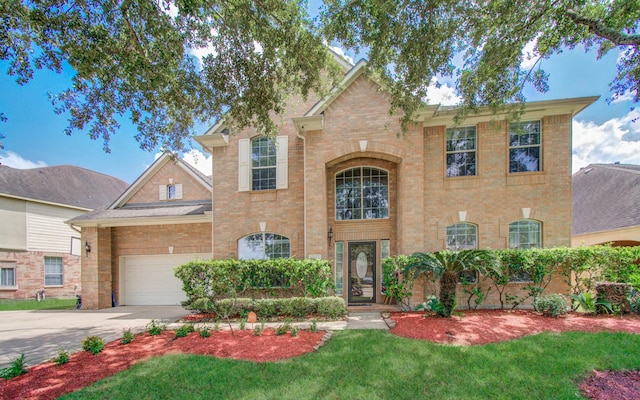 11704 Shoal Lndg, Pearland, TX 77584 - traditional-style house with driveway, brick siding, and a front lawn