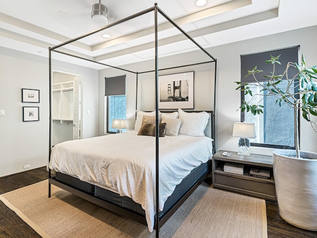 1520 Malone St, Houston, TX 77007 - bedroom with wood finished floors, a spacious closet, a raised ceiling, and recessed lighting