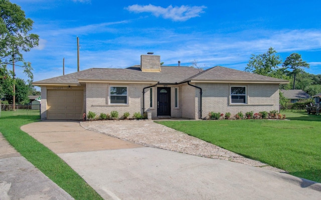 12407 Big Oaks Dr, Houston, TX 77050 - ranch-style house with an attached garage, brick siding, concrete driveway, and a chimney