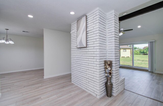 12407 Big Oaks Dr, Houston, TX 77050 - empty room featuring light wood finished floors, a chandelier, a ceiling fan, and recessed lighting