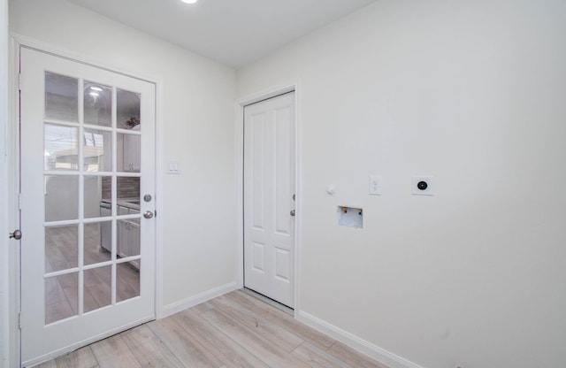 12407 Big Oaks Dr, Houston, TX 77050 - doorway with baseboards and light wood finished floors