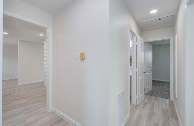 12407 Big Oaks Dr, Houston, TX 77050 - hall featuring light wood-style floors, attic access, and recessed lighting